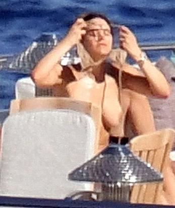 Katharine McPhee sunbathing topless on a yacht in Capri