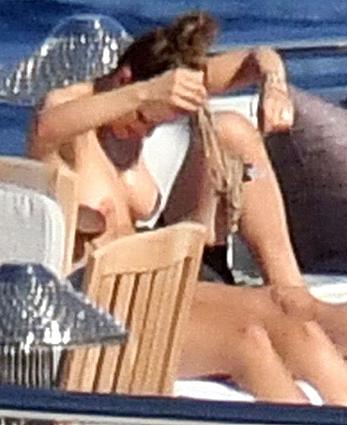 Katharine McPhee sunbathing topless on a yacht in Capri