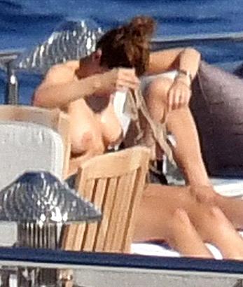 Katharine McPhee sunbathing topless on a yacht in Capri