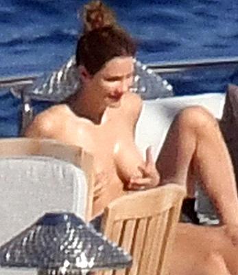 Katharine McPhee sunbathing topless on a yacht in Capri