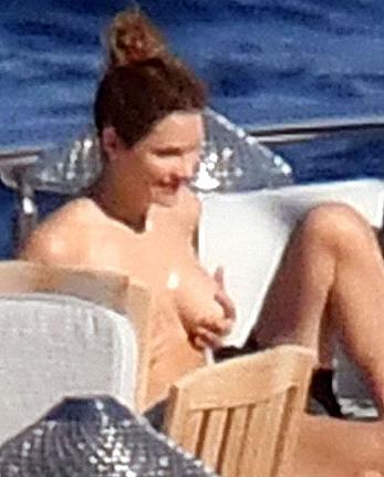 Katharine McPhee sunbathing topless on a yacht in Capri