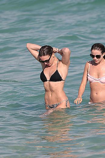 Katie Cassidy in bikini on the beach with friends