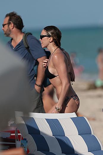 Katie Cassidy in bikini on the beach with friends