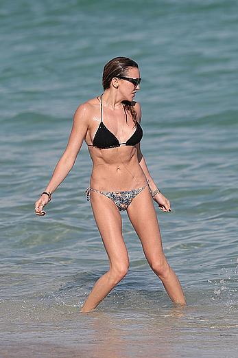 Katie Cassidy in bikini on the beach with friends