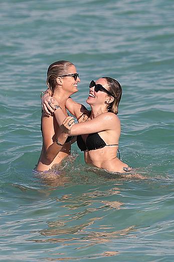 Katie Cassidy in bikini on the beach with friends