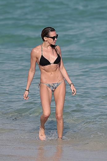 Katie Cassidy in bikini on the beach with friends