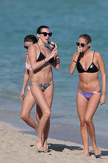 Katie Cassidy in bikini on the beach with friends