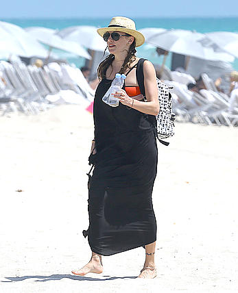 Katie Cassidy in red bikini on the beach candids