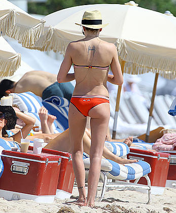 Katie Cassidy in red bikini on the beach candids