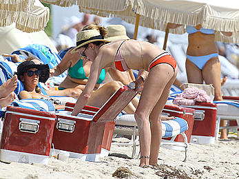 Katie Cassidy in red bikini on the beach candids