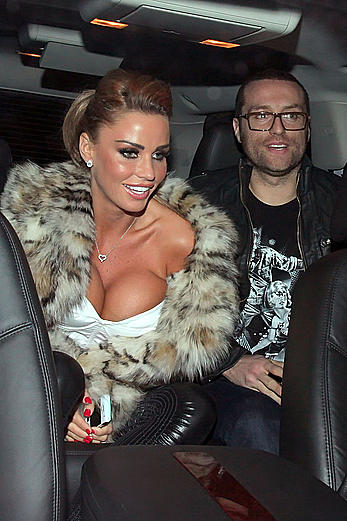 Busty Katie Price shows deep cleavage in the car