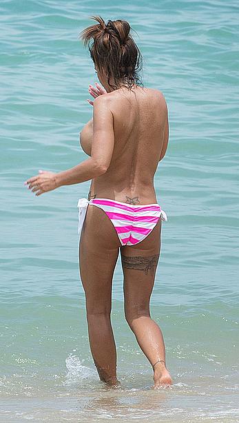 Busty Katie Price topless on a beach in Thailand