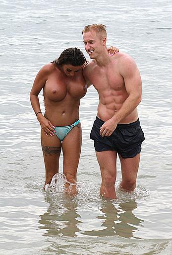 Busty Katie Price topless on a beach with boyfriend in Thailand