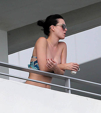 Katy Perry wearing a bikini top on a hotel balcony in Miami