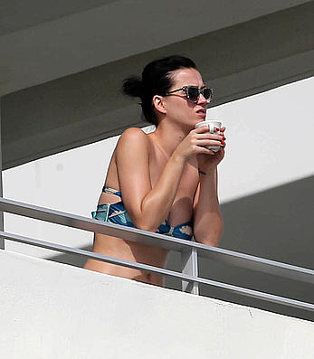 Katy Perry wearing a bikini top on a hotel balcony in Miami