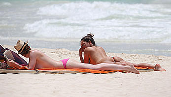 Kelly Brook caught topless on the beach in Cancun