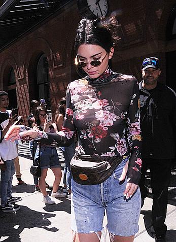 Kendall Jenner goes shopping in Soho in see through top and denim shorts