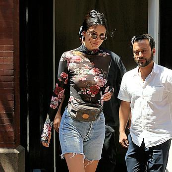 Kendall Jenner goes shopping in Soho in see through top and denim shorts