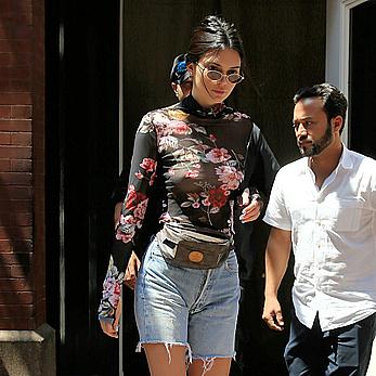 Kendall Jenner goes shopping in Soho in see through top and denim shorts