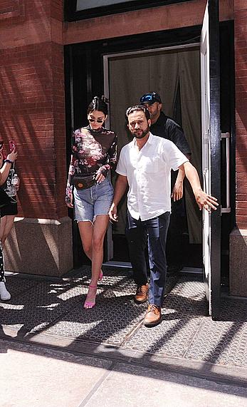 Kendall Jenner goes shopping in Soho in see through top and denim shorts