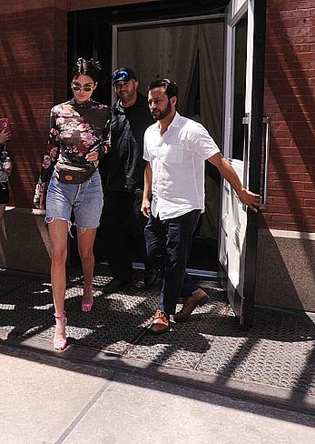 Kendall Jenner goes shopping in Soho in see through top and denim shorts