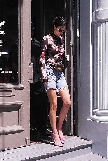 Kendall Jenner goes shopping in Soho in see through top and denim shorts