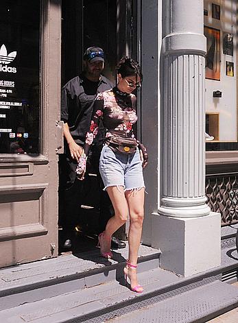 Kendall Jenner goes shopping in Soho in see through top and denim shorts