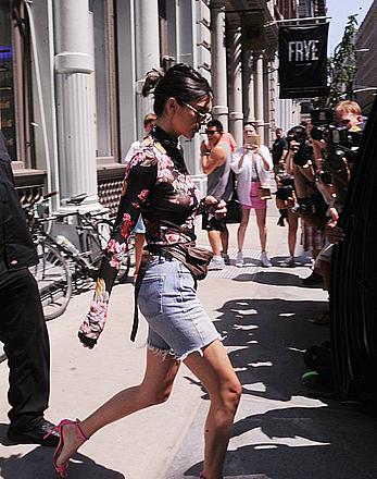 Kendall Jenner goes shopping in Soho in see through top and denim shorts