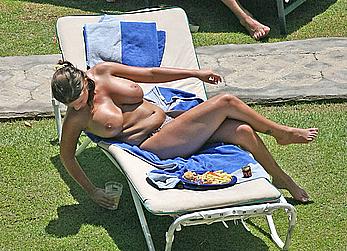 Busty Kerry Katona sunbathing topless