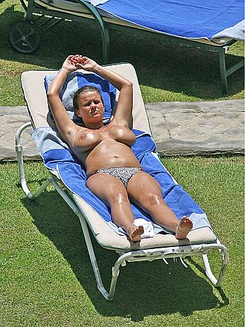 Busty Kerry Katona sunbathing topless