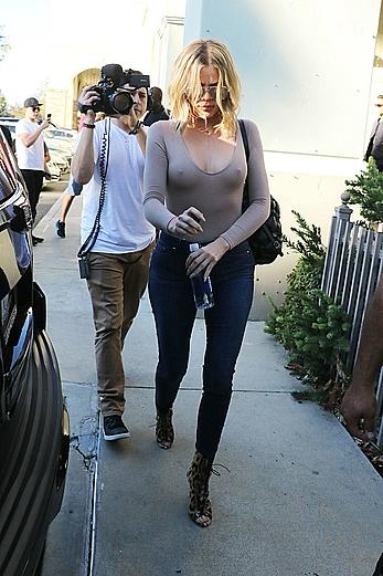 Khloe Kardashian braless under tight top shows pokies