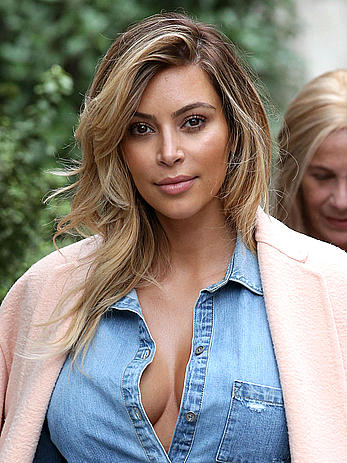 Kim Kardashian reveals cleavage for lunch in Paris