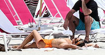 Kristen Doute topless on the beach in Miami