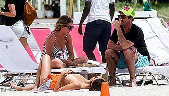 Kristen Doute topless on the beach in Miami