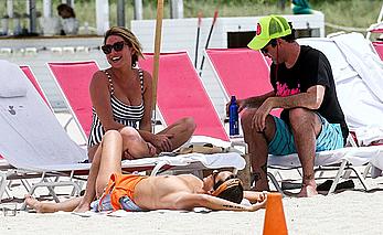 Kristen Doute topless on the beach in Miami