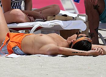 Kristen Doute topless on the beach in Miami