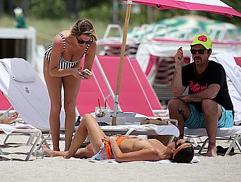 Kristen Doute topless on the beach in Miami