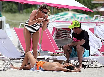 Kristen Doute topless on the beach in Miami