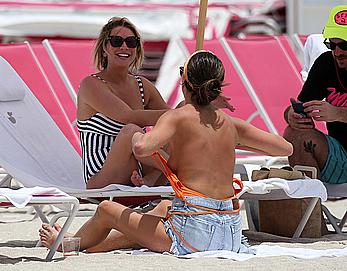 Kristen Doute topless on the beach in Miami