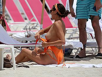 Kristen Doute topless on the beach in Miami