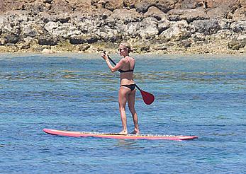 Kristin Cavallari in a bikini paddle boarding in Bali