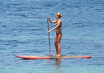 Kristin Cavallari in a bikini paddle boarding in Bali