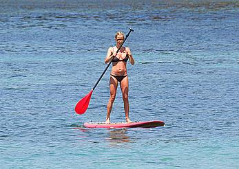 Kristin Cavallari in a bikini paddle boarding in Bali