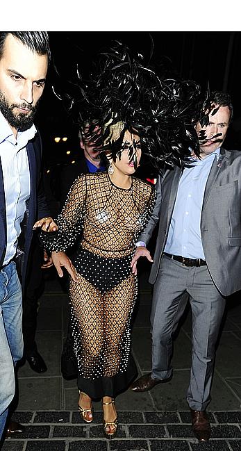 Lady Gaga topless with pasties under fishnet dress in London