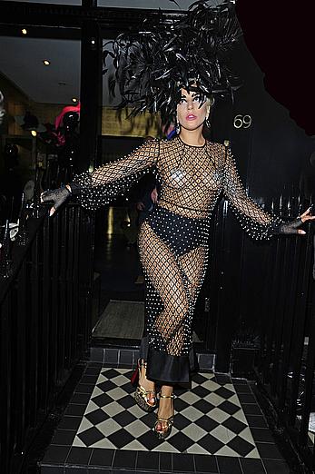 Lady Gaga topless with pasties under fishnet dress in London