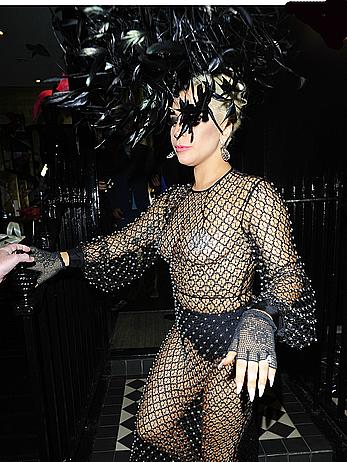 Lady Gaga topless with pasties under fishnet dress in London