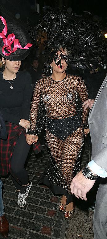 Lady Gaga topless with pasties under fishnet dress in London