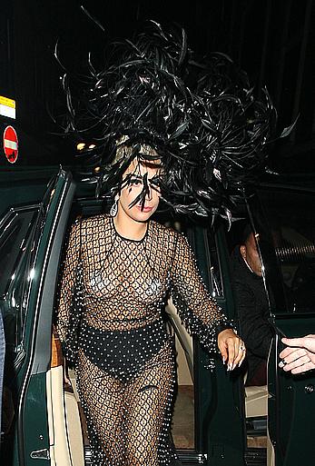 Lady Gaga topless with pasties under fishnet dress in London