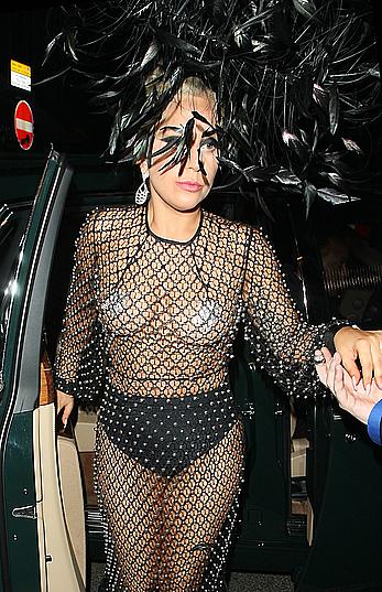 Lady Gaga topless with pasties under fishnet dress in London