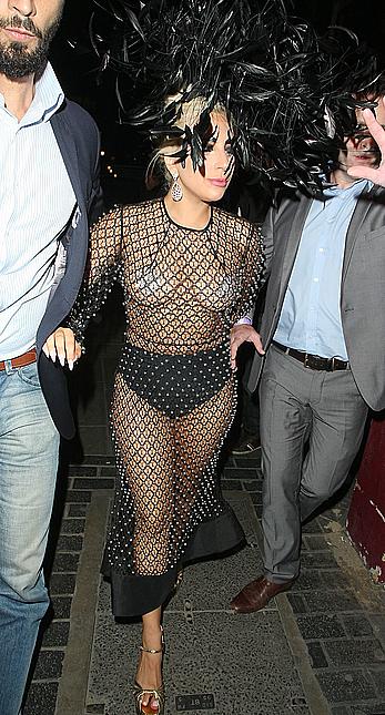 Lady Gaga topless with pasties under fishnet dress in London